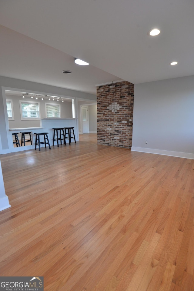 2647 Mount Carmel Rd, Hampton, GA 30228 - unfurnished living room featuring light wood-style floors, baseboards, and visible vents
