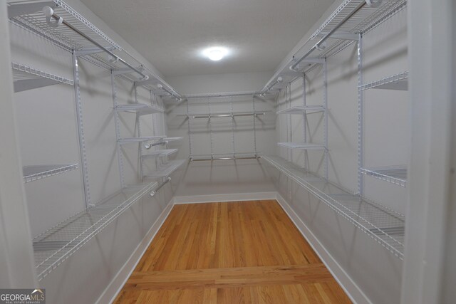 2647 Mount Carmel Rd, Hampton, GA 30228 - spacious closet featuring wood finished floors