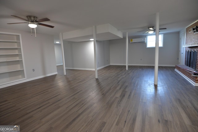 2647 Mount Carmel Rd, Hampton, GA 30228 - below grade area with a ceiling fan, built in features, a wall mounted AC, and dark wood-style floors