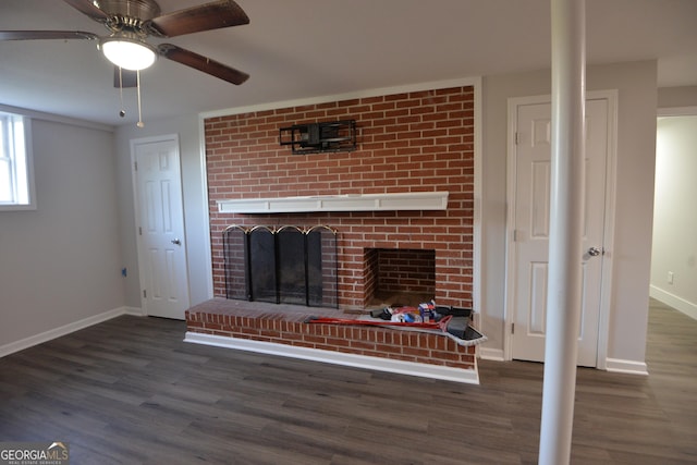 2647 Mount Carmel Rd, Hampton, GA 30228 - unfurnished living room with baseboards, ceiling fan, a brick fireplace, and wood finished floors