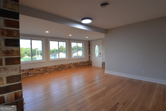2647 Mount Carmel Rd, Hampton, GA 30228 - unfurnished living room featuring recessed lighting, visible vents, a healthy amount of sunlight, and wood finished floors