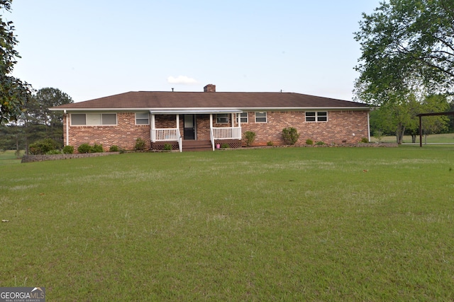 2647 Mount Carmel Rd, Hampton, GA 30228 - single story home with a porch, a front lawn, a chimney, and brick siding