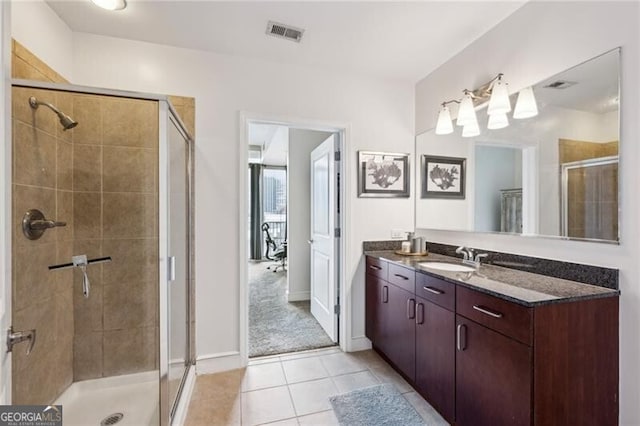 950 W Peachtree St NW Unit 904, Atlanta, GA 30309 - bathroom featuring a shower stall, tile patterned flooring, vanity, and baseboards