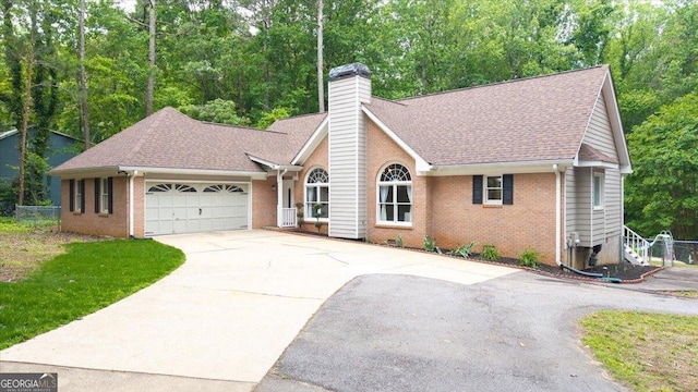 320 Williamsburg Cir, Mcdonough, GA 30253 - ranch-style house featuring roof with shingles, an attached garage, brick siding, a chimney, and driveway