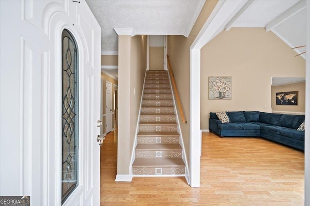 320 Williamsburg Cir, Mcdonough, GA 30253 - stairs featuring baseboards, ornamental molding, and wood finished floors
