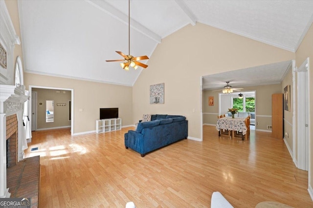 320 Williamsburg Cir, Mcdonough, GA 30253 - living area featuring a brick fireplace, ceiling fan, light wood finished floors, and high vaulted ceiling