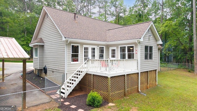 320 Williamsburg Cir, Mcdonough, GA 30253 - rear view of property with a yard, fence, a wooden deck, and roof with shingles