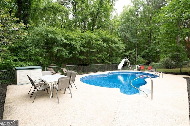 320 Williamsburg Cir, Mcdonough, GA 30253 - view of pool featuring a fenced in pool, a fenced backyard, a patio area, and a water slide