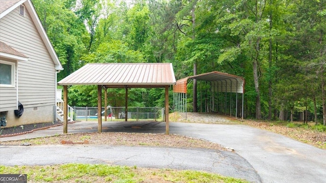 320 Williamsburg Cir, Mcdonough, GA 30253 - view of property's community featuring fence, a carport, and aphalt driveway