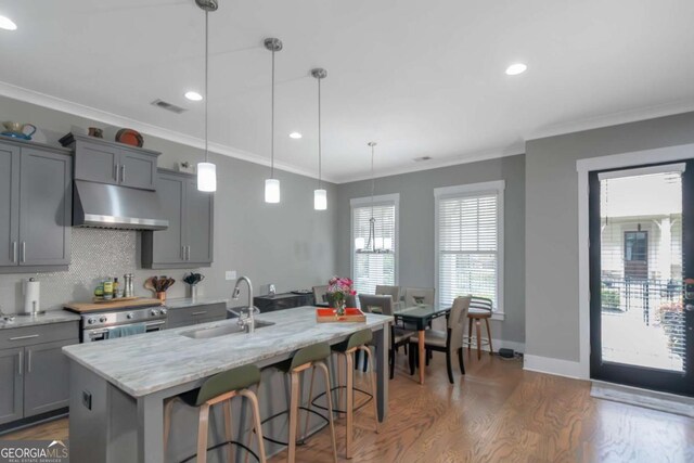 1914 Coal Pl, Atlanta, GA 30318 - kitchen with visible vents, electric range, under cabinet range hood, a sink, and gray cabinetry