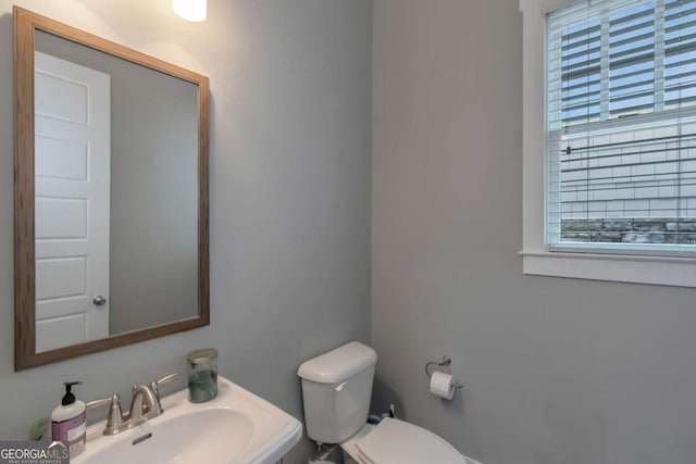 1914 Coal Pl, Atlanta, GA 30318 - half bathroom with a sink and toilet