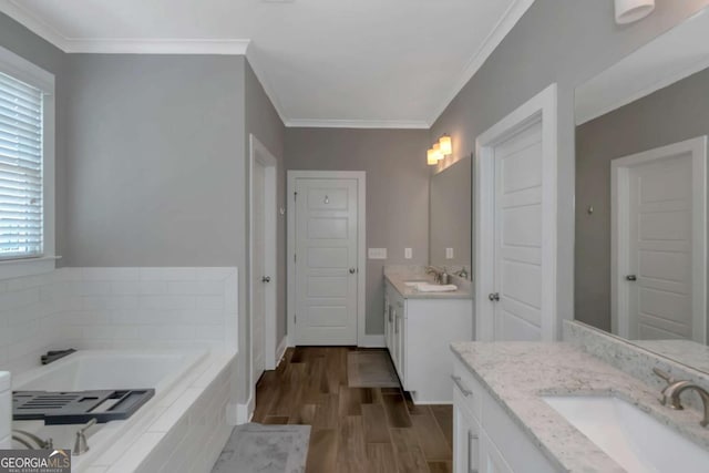 1914 Coal Pl, Atlanta, GA 30318 - bathroom featuring crown molding, two vanities, a sink, and wood finished floors