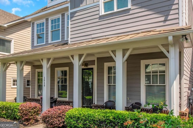 1914 Coal Pl, Atlanta, GA 30318 - doorway to property featuring metal roof, covered porch, and a standing seam roof