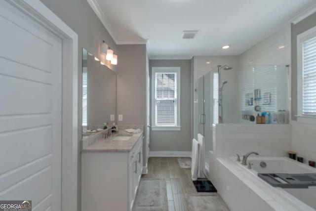 1914 Coal Pl, Atlanta, GA 30318 - full bath featuring a garden tub, a stall shower, vanity, ornamental molding, and a wealth of natural light