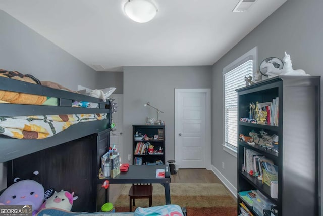 1914 Coal Pl, Atlanta, GA 30318 - bedroom featuring baseboards, wood finished floors, and visible vents