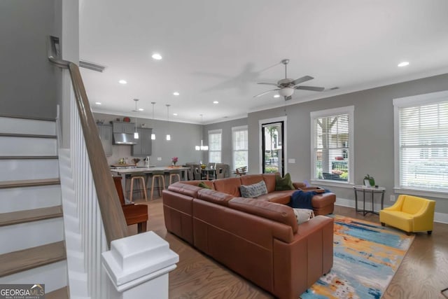1914 Coal Pl, Atlanta, GA 30318 - living room with crown molding, a ceiling fan, recessed lighting, wood finished floors, and stairway