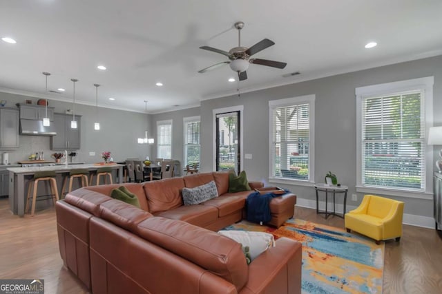 1914 Coal Pl, Atlanta, GA 30318 - living room with crown molding, visible vents, ceiling fan, recessed lighting, and light wood-style flooring