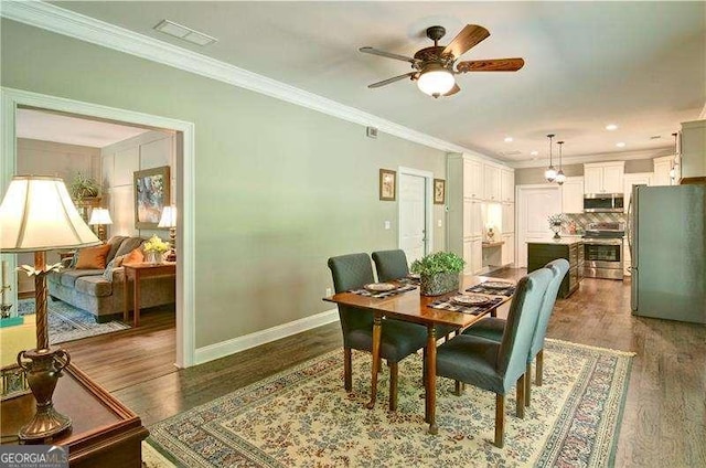 5800 Villa Rica Hwy, Dallas, GA 30157 - dining space featuring wood finished floors, crown molding, baseboards, a ceiling fan, and recessed lighting