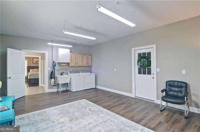 5800 Villa Rica Hwy, Dallas, GA 30157 - laundry area featuring cabinet space, washing machine and dryer, dark wood-style flooring, and baseboards