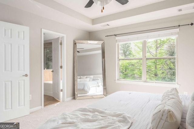 bedroom featuring carpet floors, a ceiling fan, baseboards, and connected bathroom