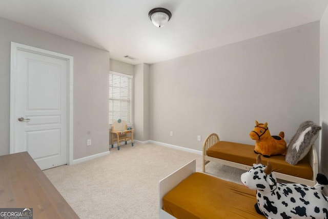 living area featuring carpet floors, baseboards, and visible vents