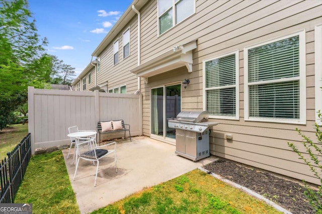 view of patio with a fenced backyard and grilling area