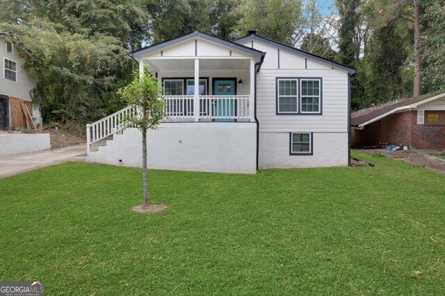 235 Holly Rd NW, Atlanta, GA 30314 - view of front of house with a porch and a front lawn
