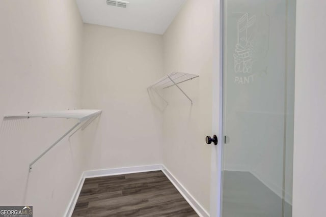 235 Holly Rd NW, Atlanta, GA 30314 - spacious closet featuring dark wood-type flooring and visible vents