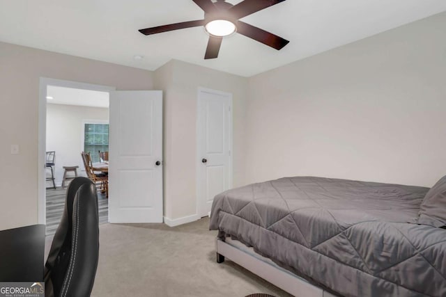 235 Holly Rd NW, Atlanta, GA 30314 - bedroom featuring baseboards, ceiling fan, and light colored carpet