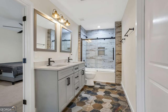 235 Holly Rd NW, Atlanta, GA 30314 - bathroom featuring double vanity, toilet, a sink, and shower / bath combination with glass door