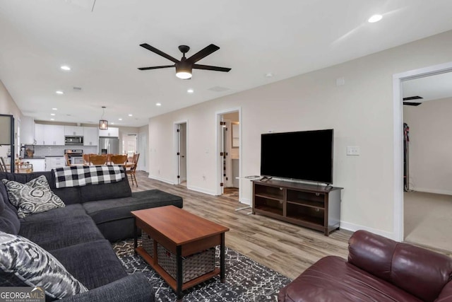 235 Holly Rd NW, Atlanta, GA 30314 - living room featuring a ceiling fan, baseboards, recessed lighting, and light wood-type flooring