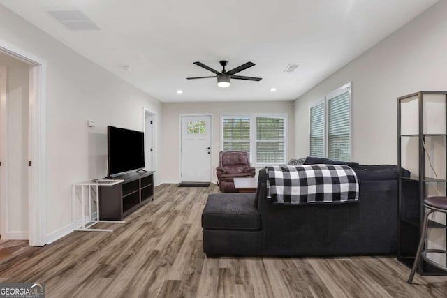 235 Holly Rd NW, Atlanta, GA 30314 - living area with a ceiling fan, baseboards, visible vents, and wood finished floors