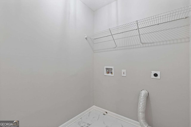 7074 Ravenwood Ln, Lithonia, GA 30038 - clothes washing area with laundry area, marble finish floor, baseboards, washer hookup, and hookup for an electric dryer