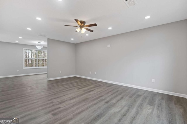 7074 Ravenwood Ln, Lithonia, GA 30038 - empty room featuring visible vents, wood finished floors, baseboards, ceiling fan, and recessed lighting