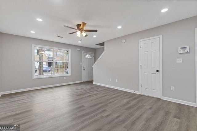 7074 Ravenwood Ln, Lithonia, GA 30038 - unfurnished living room featuring ceiling fan, recessed lighting, wood finished floors, and visible vents
