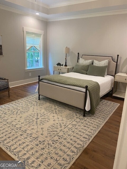 bedroom featuring baseboards, ornamental molding, recessed lighting, and wood finished floors