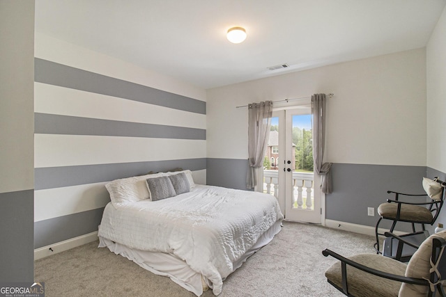 bedroom featuring visible vents, carpet floors, french doors, and access to exterior