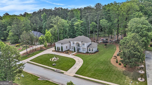 aerial view featuring a view of trees