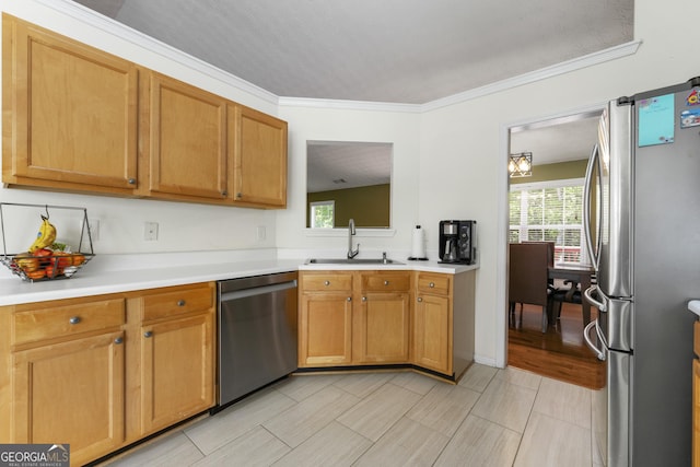 1395 Brisbane Dr, Dacula, GA 30019 - kitchen featuring stainless steel appliances, a sink, healthy amount of natural light, light countertops, and ornamental molding