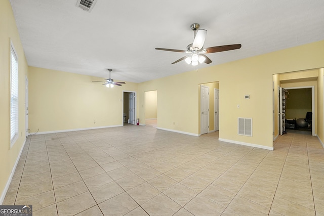 1395 Brisbane Dr, Dacula, GA 30019 - empty room featuring a ceiling fan, light tile patterned flooring, and baseboards