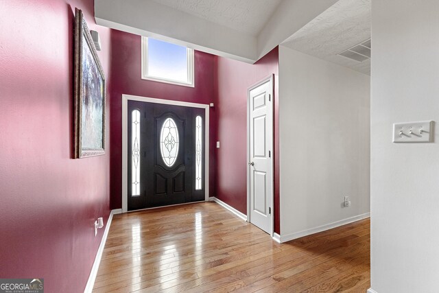 1395 Brisbane Dr, Dacula, GA 30019 - entryway with hardwood / wood-style floors and baseboards