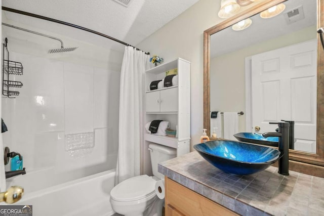 full bath featuring vanity, shower / bath combination with curtain, toilet, and visible vents
