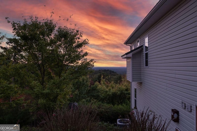 view of property exterior at dusk