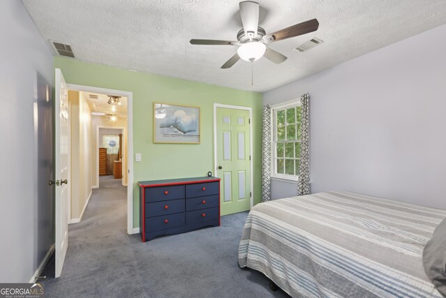 3876 Winners Ct, Marietta, GA 30062 - carpeted bedroom with a textured ceiling and a ceiling fan