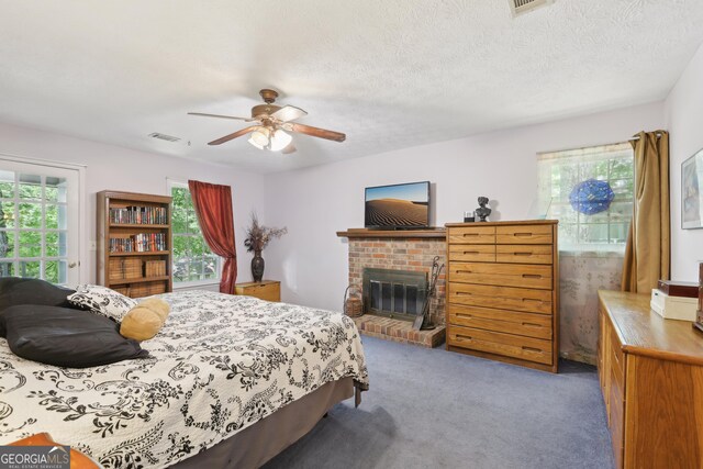 3876 Winners Ct, Marietta, GA 30062 - carpeted bedroom with a brick fireplace, access to exterior, and a ceiling fan