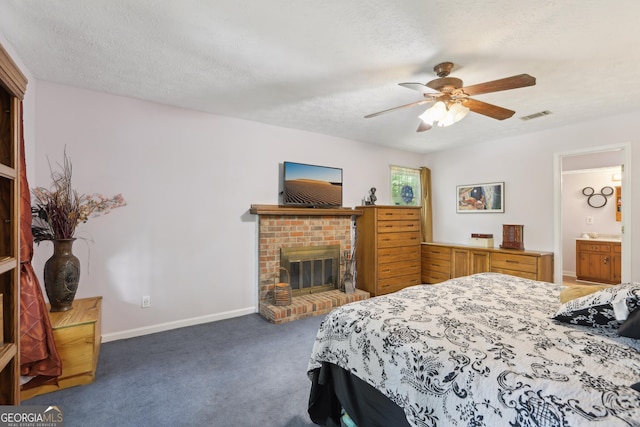 3876 Winners Ct, Marietta, GA 30062 - bedroom with a brick fireplace, carpet, a ceiling fan, and a textured ceiling