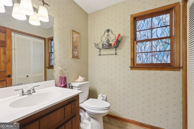 3876 Winners Ct, Marietta, GA 30062 - bathroom featuring wood finished floors, a closet, and vanity