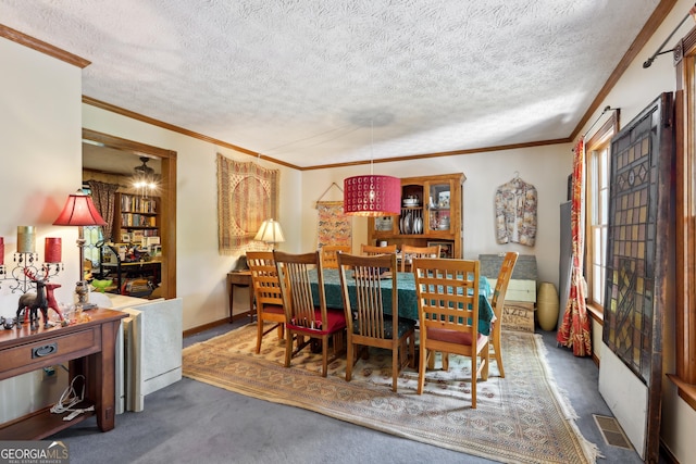 3876 Winners Ct, Marietta, GA 30062 - carpeted dining room with ornamental molding and a textured ceiling