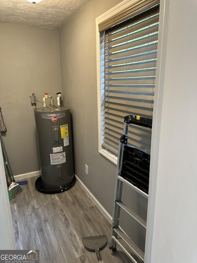 utility room featuring water heater