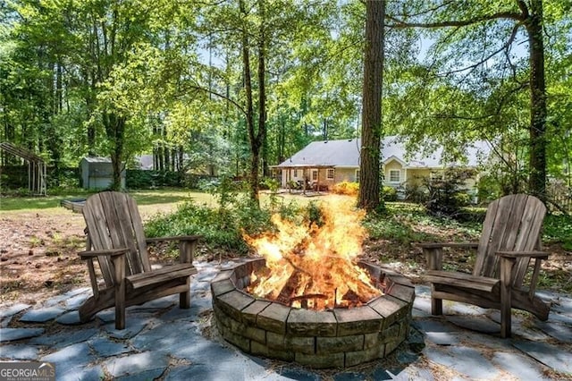 view of patio featuring a fire pit